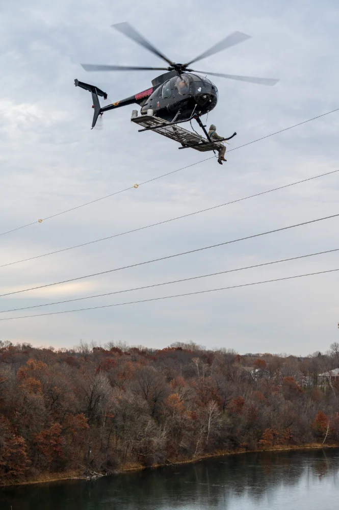 Hughes 369D working on the power lines